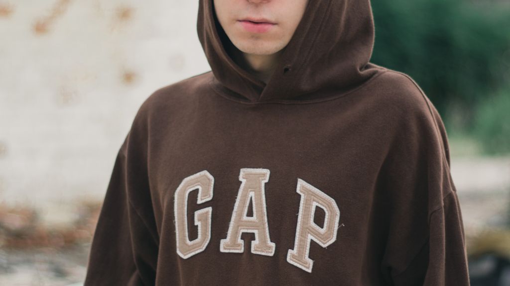 a person wearing a GAP hoodie