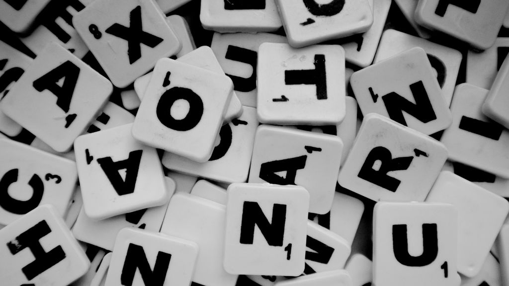 scrabble letter tiles in black and white