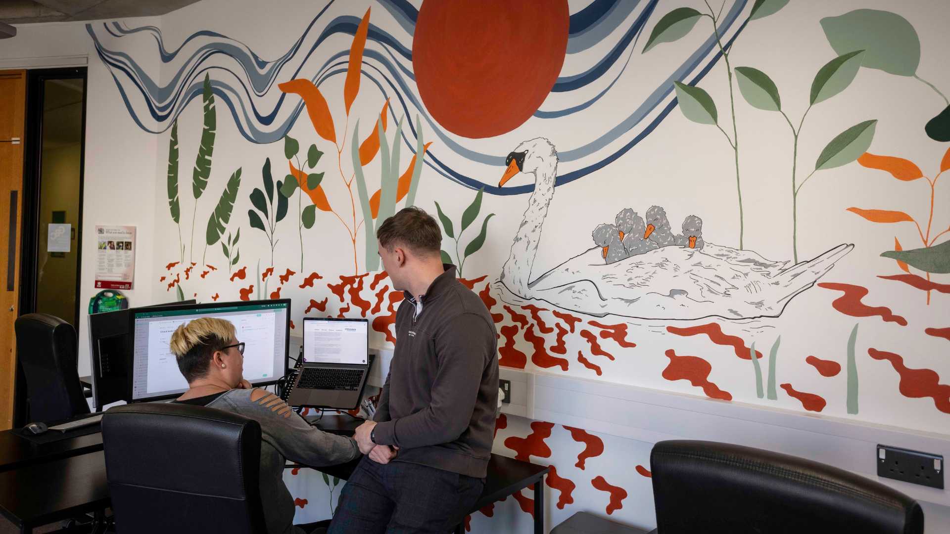 Adam and Laura talking in Office Adam and Laura talking in Office