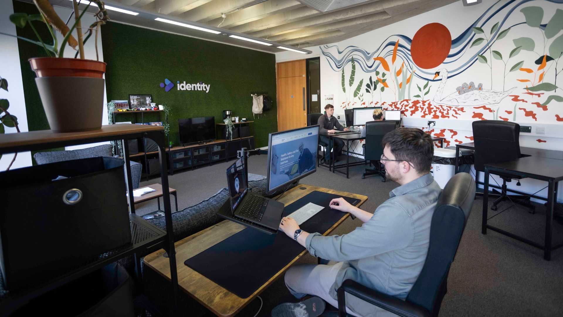 Team on Desks in Office