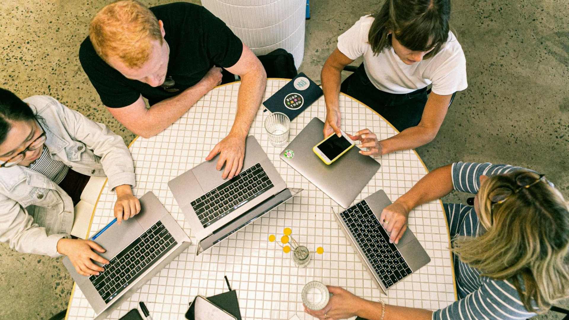 Group on Laptops in Meeting Group on Laptops in Meeting